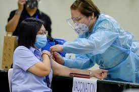 A health worker prepares to administer a dose of pfizer vaccine at a vaccination hub in paranaque city on may 18, 2021. As Philippines Seeks Covid 19 Vaccines Ghost Of Dengvaxia Controversy Lingers South China Morning Post