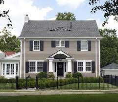 Try gray, green, or white house colors. Colors To Go With A Grey Roof Ehow House Paint Exterior Exterior Paint Colors For House Colonial House Exteriors