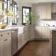 The undertone of this hue is gray, which is one of the reasons this kitchen has a soft and elegant feel. Kitchen Bath Showroom Taupe Kitchen Taupe Kitchen Cabinets Kitchen Cabinets Color Combination
