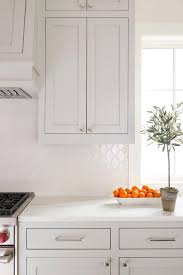The Diamond Shaped Backsplash Adds An Element Of Subtle Modern Interest Over White Quartz Counte Kitchen Backsplash Trends White Kitchen Quartz Quartz Kitchen