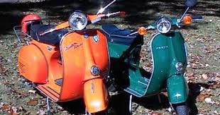 a pair of vespa scooters vespa scooters vespa classic vespa