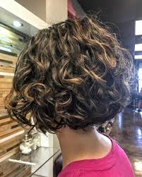 An easy way to switch up the curly bob haircut or any haircut is to make it asymmetrical. 29 Most Flattering Short Curly Hairstyles To Perfectly Shape Your Curls Short Curly Bob Hairstyles Curly Hair Trends Short Layered Curly Hair