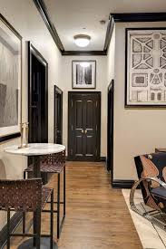 Where a window might normally get lost in a space, black demands attention and highlights what's often black trim works especially well with white or very light walls, creating a strong contrast for a modern look. Upper Manhattan Bachelor Pad By Elizabeth Bolognino Interiors Interiordesign Moderndesign Manhattan Nyc Doors Interior Black Interior Doors Home