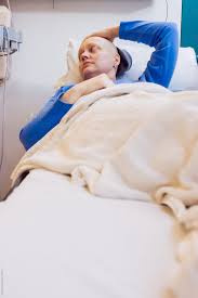 A cancer woman is actively emotional in a relationship because she is a traditionalist. A Woman At The Hospital For A Round Of Chemotherapy Cancer Treatment By Shelly Perry