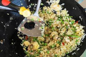 Nasi goreng — istimewa special fried rice with sausages, egg, krupuk (prawn cracker) and pickles. Nasi Goreng Add Soy Sauce Taste Of Asian Food