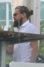 Sporting a man bun and wild beard, leonardo dicaprio was spotted leaving the armani hotel in milan on thursday night. The Evolution Of Leonardo Dicaprio S Ever Growing Beard In 11 Photos