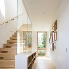 Small bright foyer featuring a hardwood flooring and a plant on the side for a refreshing look. 75 Beautiful Modern Hallway Pictures Ideas March 2021 Houzz