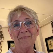 What is a neat 2x2 rib bind off technique for a neckline?