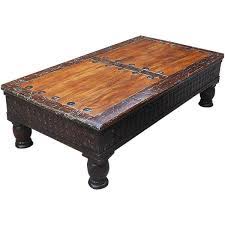 The round coffee table is reserved for those carving out a cool, eclectic aesthetic. Rustic Carved Coffee Table Made Of Acacia Mango Wood