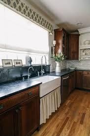 The kitchen backsplash tile pattern is unique and eye catching, but does not overwhelm the overall elegance of the kitchen. Cherry Cabinets Design Ideas