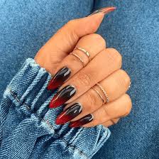 These ombre style nails are painted in hot pink and various designs are added such as a heart, dots, stripes, and others. These Nail Designs Prove Black Red Are The Best Combo