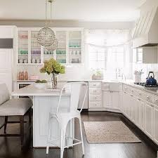 This kitchen island from kraftmaid has plenty of seating options. Island With Corner Sink Design Ideas