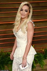 Look at rita ora younger pictures especially from child to teen she looked white. Rita Ora Arrives At Vanity Fair Oscars Party In Low Cut Lace Dress Daily Mail Online