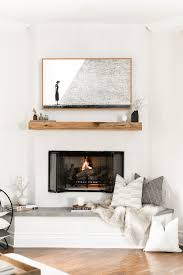 Explore luxury interior surround ideas and architecture inspiration. Cozy Plaster Fireplace With Floating Reclaimed Wood Mantel Fireplace Hearth Minimalist Fireplace Fireplace Hearth Decor