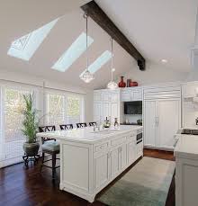 Kitchen skylights not only improve the aesthetics of the room, they are great sloped ceilings seem absolutely perfect for skylights, and kitchens with such ceilings have a dramatic and timeless appeal. White Kitchen W Skylights American Traditional Kitchen Chicago By Benvenuti And Stein