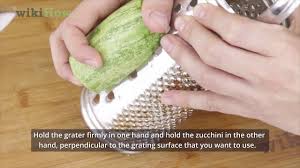 To grate zucchinis for zucchini bread, use the largest grate on a box grater, food processor, or your grater of choice. How To Grate Zucchini Youtube