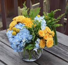 Spring Flower Bowl With Hydrangeas Spray Roses Craspedia Blue Flower Arrangements Fresh Flowers Arrangements Graduation Flowers