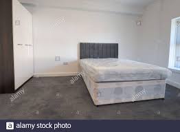 What color carpet goes with white walls white bedroom carpet white bedroom carpet what color white carpet and large leather chest in modern bedroom with. A Newly Decorated Typical British Uk Bedroom With A Large Bed With White Walls Grey Carpet With Blinds At The Window Stock Photo Alamy