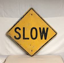 Black And Yellow Sign On Road 1960 S Pressed Steel Slow Street Road Sign 24 Yellow And Black Yellow Sign Road Signs Yellow Road Signs