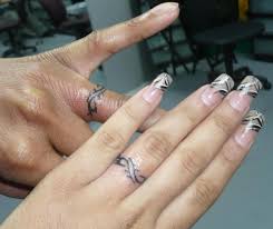 Wedding Ring Tattoos Designs Ideas And Meaning Tattoos For You Ring Tattoo Designs Ring Finger Tattoos Wedding Ring Tattoo