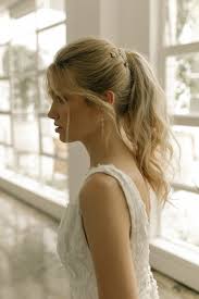 If you have a wedding coming up then why not steal the show with this incredible style that incorporates two braids into your ponytail. Playful Ponytails Styling The Classic Wedding Ponytail Tania Maras Bespoke Wedding Headpieces Wedding Veils