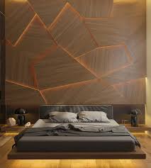 Installing a wood panel accent wall is a great way to add warmth, texture, and rustic appeal to a space. This Bedroom Has A Geometric Back Lit Wood Accent Wall