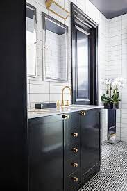 Blackened bronze fixtures help this shower to feel integrated into the space. 40 Black White Bathroom Design And Tile Ideas