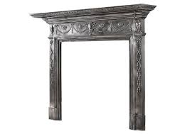 A 19th century polished cast iron fireplace mantel in the Adam style