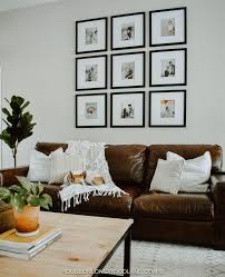 Black And White Pillows On Brown Leather Couch Cozy Dreamy Home Tour No 4 Grace Gathered Girl Living Room Leather Leather Couches Living Room Couch Decor