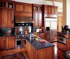 In addition to its distinct color, cherry is strong, durable and easy to work with, making it one of the most popular wood types in cabinetry and furniture making. Kitchen With Cherry Cabinets Decora Cabinetry