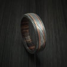 Damascus Steel Ring With 14k Rose Gold Inlays And Hardwood Sleeve Damascus Steel Ring Mens Wedding Rings Steel Ring