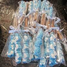 Candy Melts In Molds With Large Pretzel Rods Baby Shower Candy Molds Baby Shower Treats Baby Boy Shower