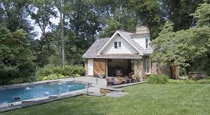 Beautiful Country Pool House With White Siding Real Stone Veneer In Ground Pool Outdoor Kitchen Pool Houses Country Pool House Stone Pool House