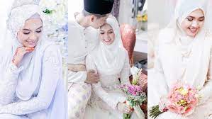 Warna putih dipilih karena dekat dengan makna akad nikah yang putih dan suci. Inspirasi Gaun Pengantin Hijab Warna Putih Cocok Untuk Akad Nikah Fimela Fimela Com