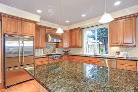 This farmhouse style light brown wood cabinet will make a perfect décor in your living room when paired with matching décor and colorway. Luxury Kitchen With Kitchen Island Light Wood Cabinets Fitted Stock Photo Picture And Royalty Free Image Image 97392262