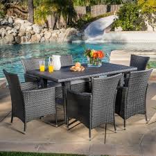 The really cool thing about this online deal is that you. Noble House Malta Grey 7 Piece Wicker Rectangular Outdoor Dining Set With Silver Cushions 8211 The Wicker Dining Set Patio Dining Set Outdoor Furniture Sets