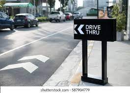 Post drive thru signs to help customers find the entrance and to thank them for coming. Drive Thru Sign Shop Background Stock Photo Edit Now 587904779