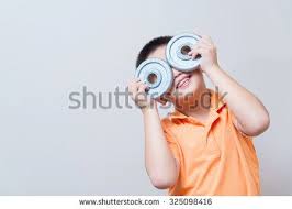asian boy joking gesture wearing fake glasses made with iron dumbbell concept idea on grey wall background with soft shadow asian boys fake glasses asian