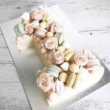 Your Very First Birthday Is Always A Little Bit More Special Floral Macaron Chocolate Number One Number One Cake 1st Birthday Cakes First Birthday Cupcakes