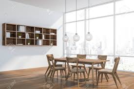 But when paired with the wrong furnishings and colours, those floors run the risk of making the space feel dark. Corner Of Modern Dining Room With White Walls Wooden Floor Stock Photo Picture And Royalty Free Image Image 124681473