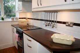 Black granite worktop with cream floor tiles via pinterest.co.uk. How To Tile Bathrooms Or Kitchens Using Metro Or Subway Tiles Make It Moregeous