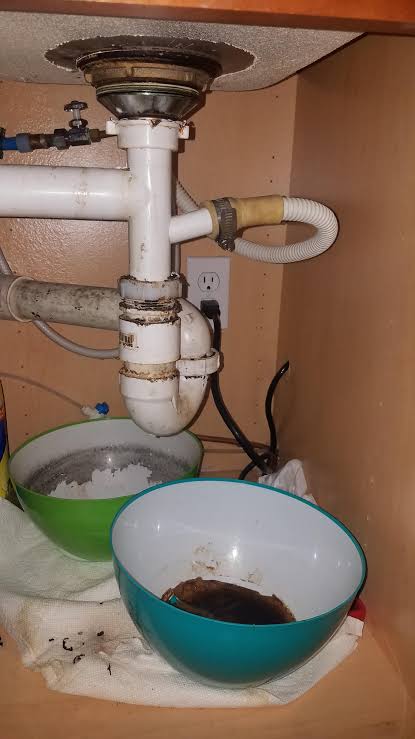 Kitchen sink has black discharge from piping. What is it? Is this a simple case of the normals, just reseal the threads? Or is it a sign of something worse. Front bowl