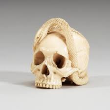This ivory netsuke is in the form of tanuki, carrying his grossly enlarged scrotum. A Japanese Ivory Netsuke Meiji Period 1868 1912 Bukowskis