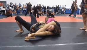 Girl Wins by Headscissors in a BJJ Match - Wrestling Dommes