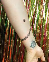 Above the pearl tattoo is a private, appointment only portland tattoo studio. Dark Pearls Tattoo On The Forearm