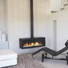 Warm up your life with these 13 freestanding fireplace designs | the unique shape of this portable freestanding fireplace allows it to be enjoyed. Stand Alone Fireplaces