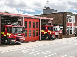 Fire exit, fire extinguisher, fire hose reel, high voltage stay. Stevenage Fire Station Hertfordshire County Council