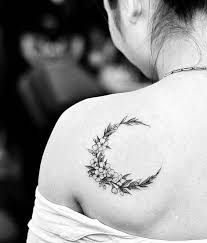 Black And White Cherry Blossom Shoulder Tattoo Moon Shaped Cherry Blossom Flower Wreath Tattoo On The Left Shoulder Blade Tattoo Artist Drag Shoulder Tattoo Wreath Tattoo Shoulder Blade Tattoo