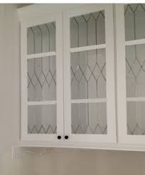 Thin strips of wood separate panes of glass. Leaded Glass Inserts For Kitchen Cabinets