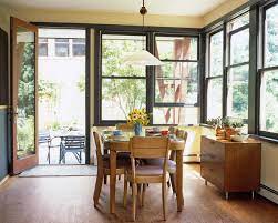Balance a dense pedestal table with clear or aluminum chairs. Yellow Retro Dining Room Dining Room Decorating Ideas Lonny